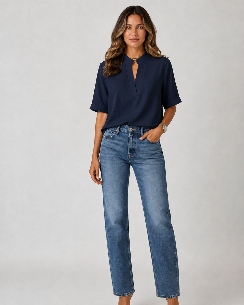 Elegant blouse with V‑neck and gold‑toned details